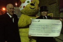 Andrea Button with Pudsey bear for charity collection